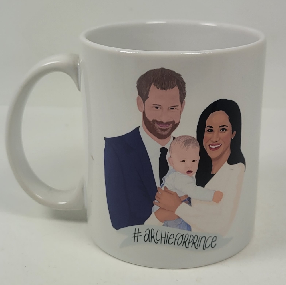 Francesca's This is a ceramic mug featuring an illustration of Prince Harry, Meg